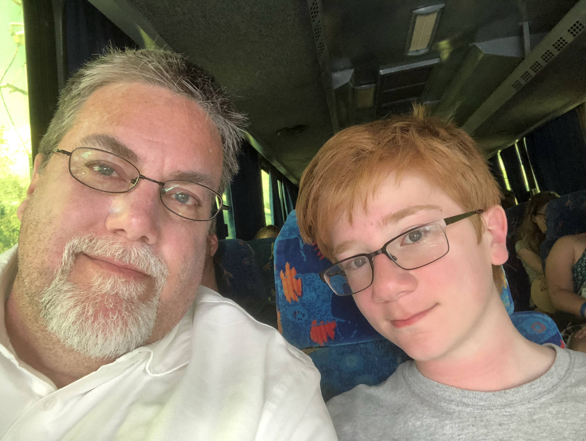 David Brodosi and his son traveling on a bus